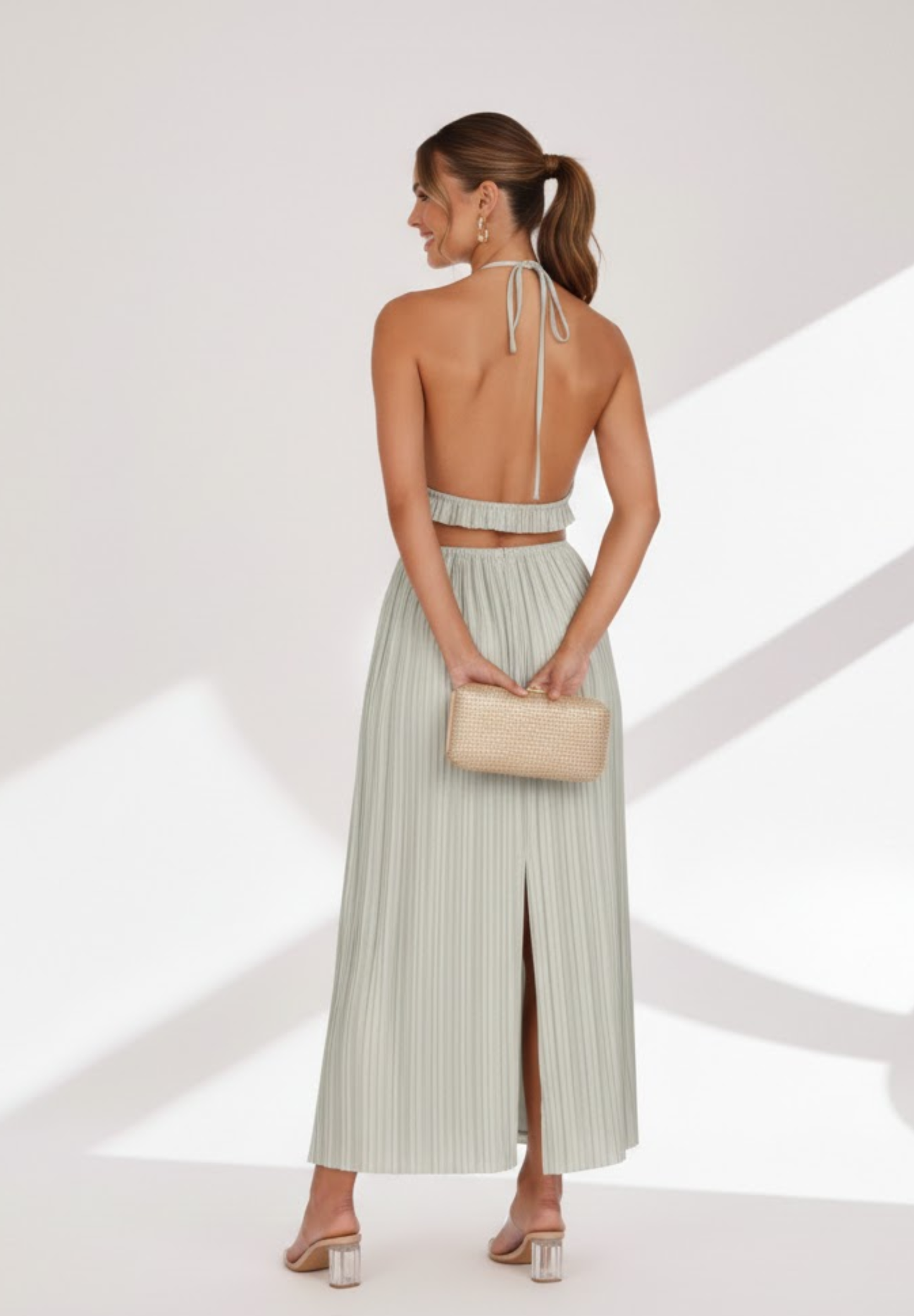 Jupe longue à dos nu plissée