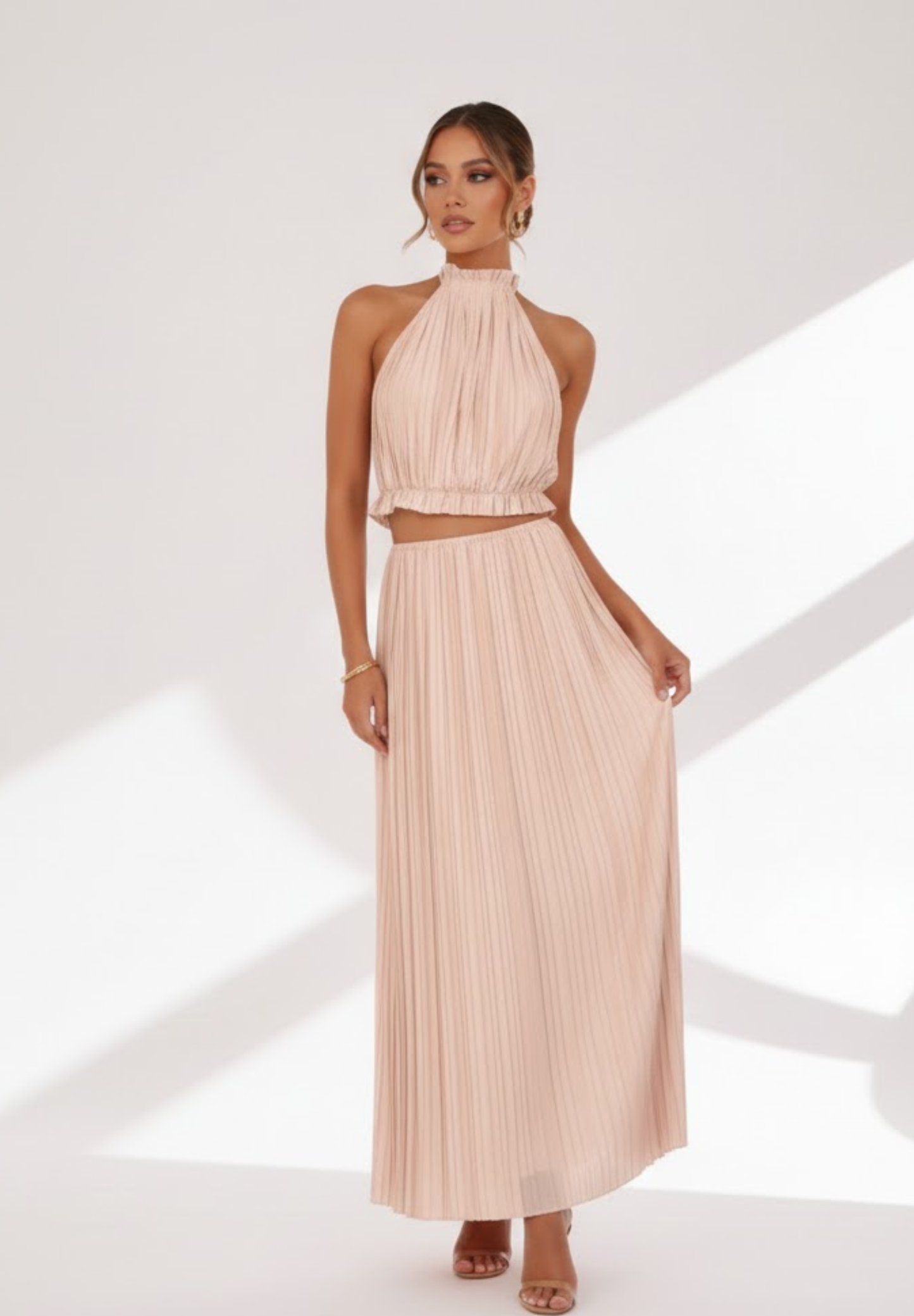 Jupe longue à dos nu plissée